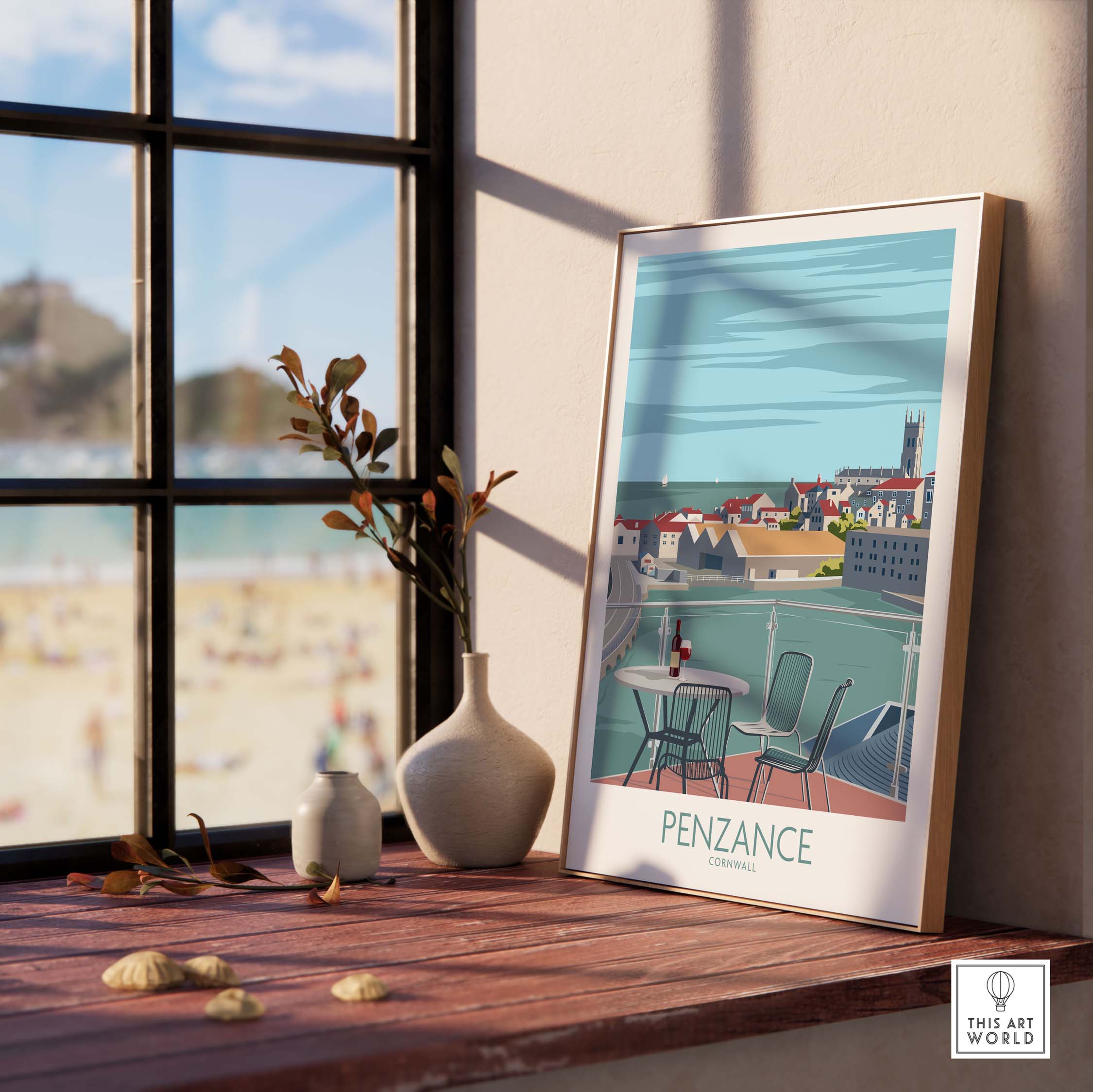 Penzance Poster Cornwall Print framed on a wooden shelf, with beach view and decorative vase.