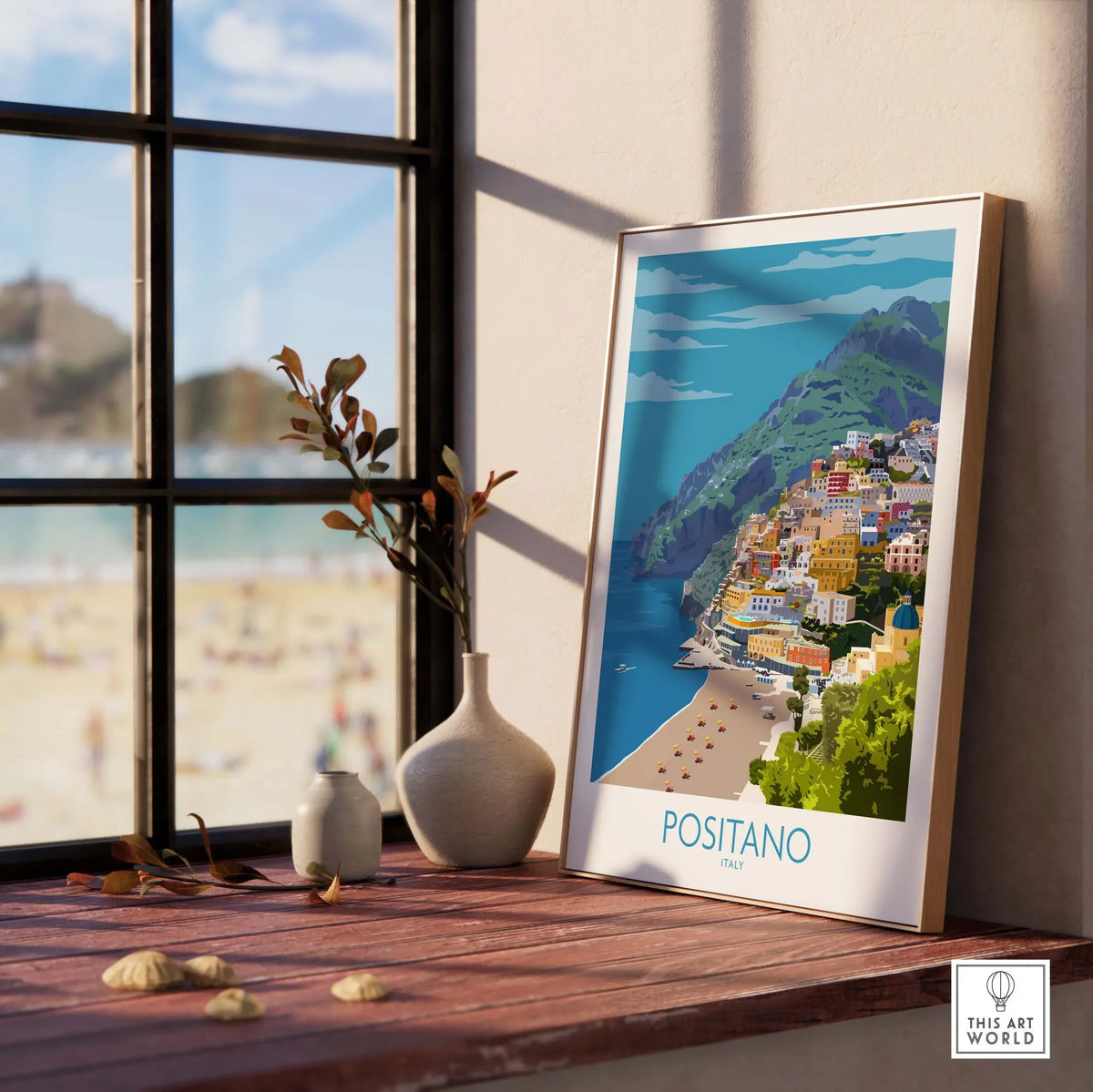 Positano print travel poster displayed near a window with beach views, highlighting vintage travel art inspiration.