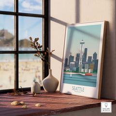 Seattle poster print showcasing iconic skyline, framed and placed on a windowsill with a beach view.