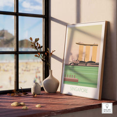 Stylish Singapore print travel poster displayed near a window with beach view, showcasing vintage-inspired art.
