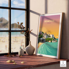 Skiathos travel poster print showcasing a serene beach scene, framed and displayed in a stylish interior setting.