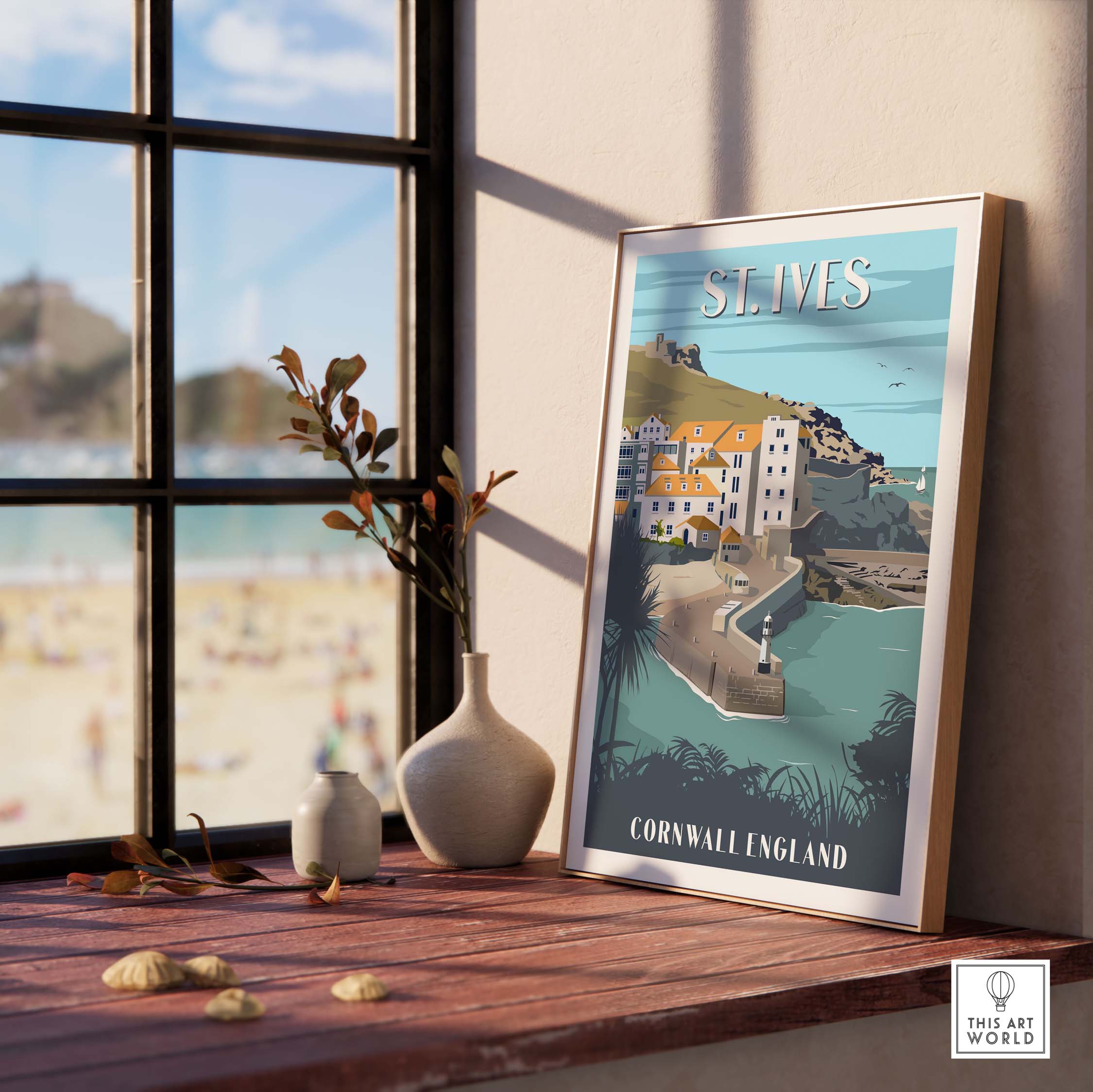 Framed St Ives poster print showcasing Cornwall, England, on a stylish side table near a window.