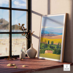 Tuscany Italy wall art poster displayed in a bright room by a window, showcasing vibrant landscapes and a tranquil vibe.