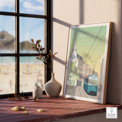 Framed Zurich Print Wall Art Poster displayed on a windowsill, showcasing vintage travel inspired design.