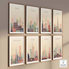 Framed city skyline prints of Rome, London, Tokyo, Paris, New York, Dubai, Sydney, and Bangkok on a wall.