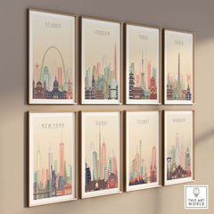 St Louis City Skyline Wall Art print along with other city skylines in pastel tones, framed on a wall.