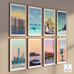 Collection of travel-inspired posters featuring Amsterdam, Iceland, New York, Cape Town, and more in stylish frames.