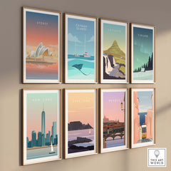 Set of vintage travel posters featuring Sydney, New York, and other destinations, framed on a modern wall.