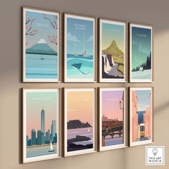 Gallery of vintage travel posters including Tokyo, New York, and Paris on a wall.