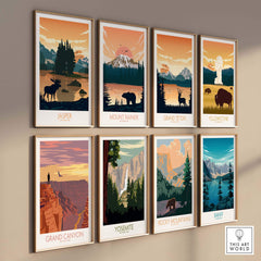 A collection of eight framed national park posters, featuring designs for Jasper, Mount Rainier, Grand Teton, and more.