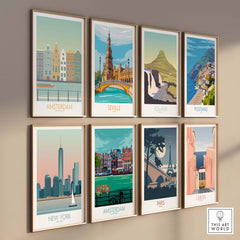 Collection of vintage travel art prints featuring Amsterdam, Paris, and more, displayed in elegant frames.