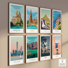 Colorful vintage travel posters featuring Barcelona, Seville, Iceland, Positano, New York, Amsterdam, Paris, and Lisbon.