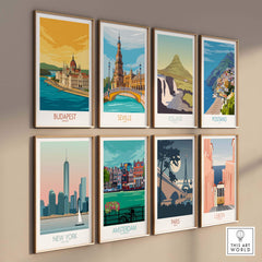 Collection of vintage travel posters featuring Budapest, Seville, Iceland, Positano, New York, Amsterdam, Paris, and Lisbon.