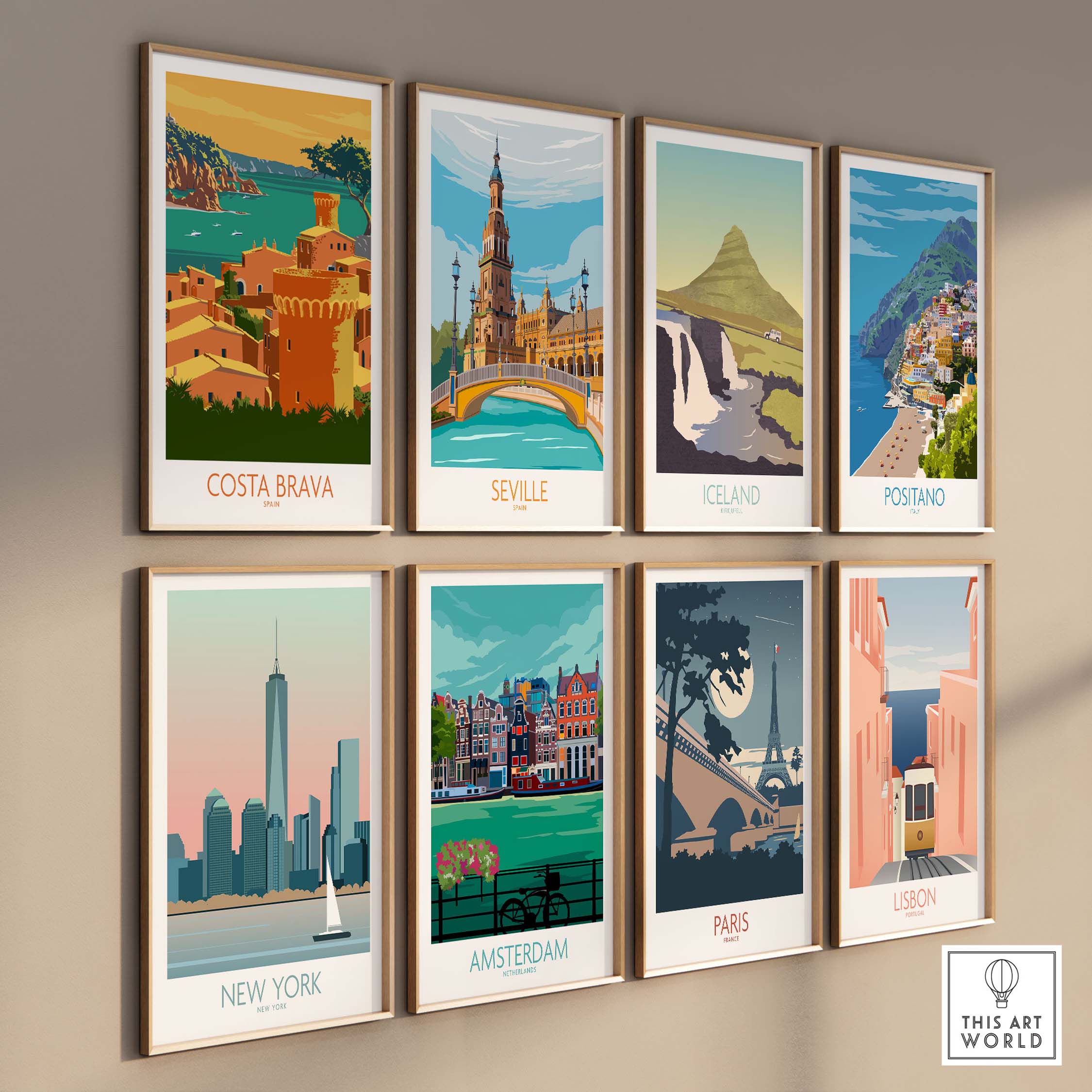 Costa Brava and European city travel posters displayed in a modern gallery wall setting.
