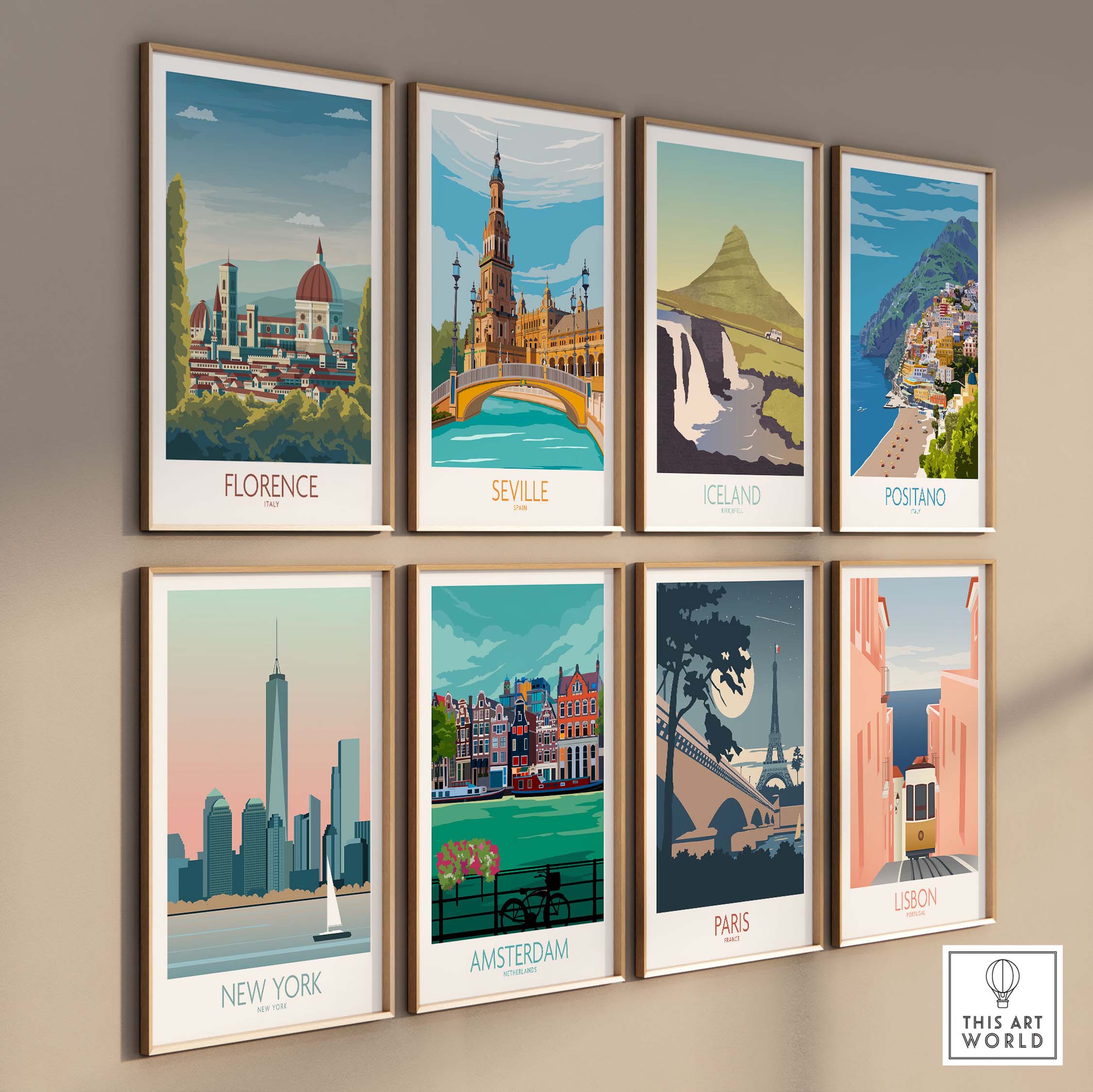 Framed art prints of Florence, Seville, Iceland, Positano, New York, Amsterdam, Paris, and Lisbon on a wall.