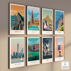 Collection of travel poster art prints featuring Gibraltar, Seville, Iceland, Positano, New York, Amsterdam, Paris, and Lisbon.