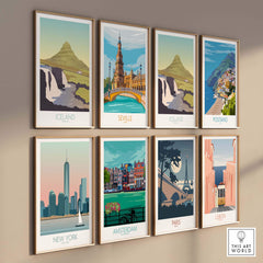 Set of framed travel posters featuring Iceland, Seville, Positano, New York, Amsterdam, Paris, and Lisbon.