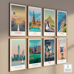 Colorful travel art prints including Las Vegas, Seville, Iceland, and more displayed on a wall.