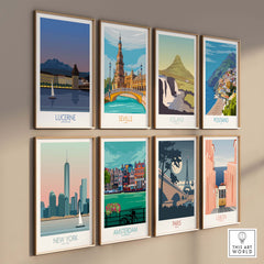 Gallery wall featuring vintage travel posters of Lucerne, Seville, Iceland, Positano, New York, Amsterdam, Paris, and Lisbon.