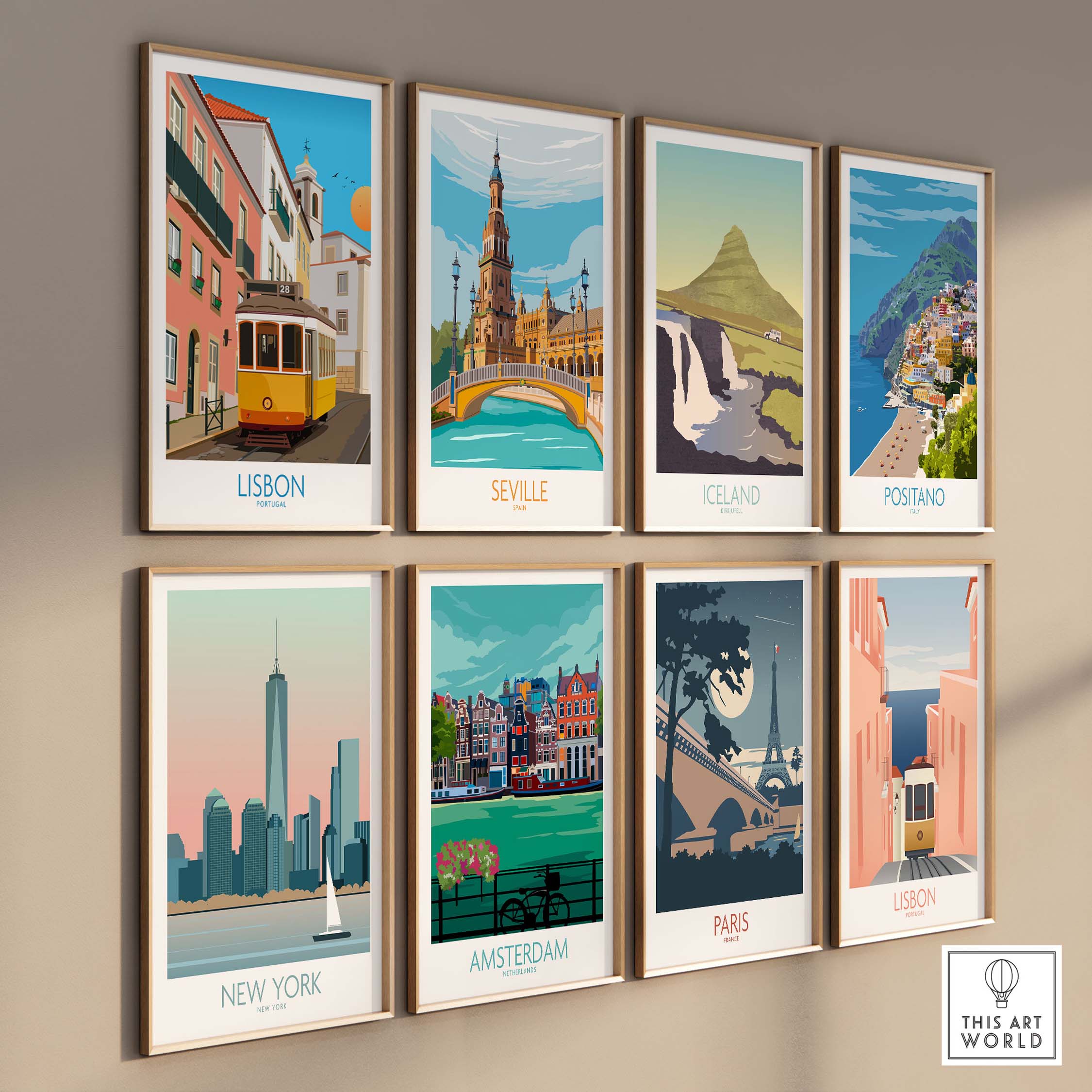 Wall art display featuring travel posters of Lisbon, Seville, Iceland, Positano, New York, Amsterdam, Paris.