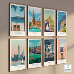 Colorful vintage-style travel poster prints showcasing Maldives, Seville, Iceland, Positano, New York, Amsterdam, Paris, and Lisbon.