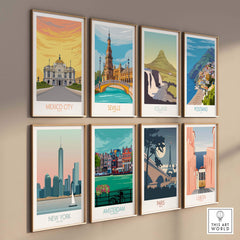 Colorful travel poster prints featuring Mexico City, Seville, Iceland, Positano, New York, Amsterdam, Paris, and Lisbon.
