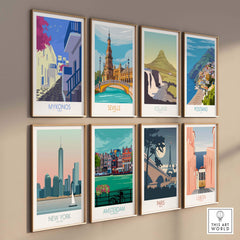 Collection of travel posters featuring Mykonos, Seville, Iceland, Positano, New York, Amsterdam, Paris, and Lisbon.