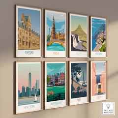 Collection of vintage travel wall art prints featuring Oxford, Seville, Iceland, Positano, New York, Amsterdam, Paris, and Lisbon.