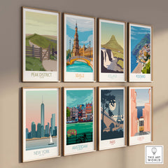 Collection of vintage travel art prints featuring the Peak District, Seville, Iceland, Positano, New York, Amsterdam, Paris, and Lisbon.