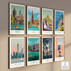 Vintage travel art prints featuring cities like Prague, New York, and Paris, displayed in frames on a wall.