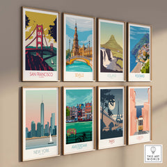 Colorful travel poster prints featuring San Francisco, New York, Paris, and more, displayed in stylish frames on a wall.