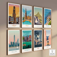 Collection of vintage travel poster prints including Amsterdam, New York, and Paris, displayed in stylish frames.