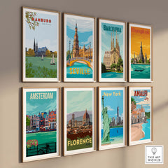Gallery wall featuring vintage travel posters from Hamburg, Barcelona, Bangkok, Seville, Amsterdam, Florence, New York, and Amalfi.