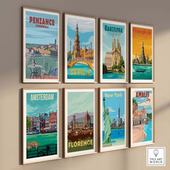 Stylish travel poster prints featuring Penzance, Barcelona, Amsterdam, and more, displayed in a modern gallery wall.