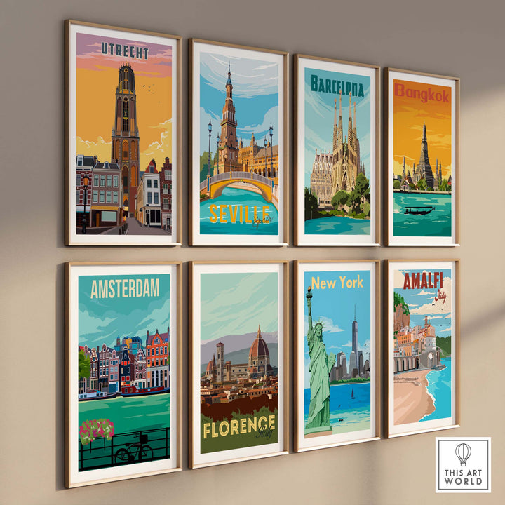 A set of 8 travel posters all framed on a wall featuring Utrecht, Seville, Barcelona, Bangkok, Amsterdam, Florence, New York and Amalfi Coast. 