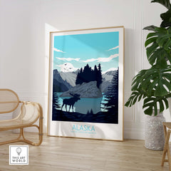 Alaska travel poster featuring a moose by a lake, surrounded by mountains and trees, perfect for home or office decor.