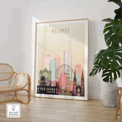 Belfast skyline print showcasing iconic buildings in warm pastel tones, framed artwork in modern interior design setting.