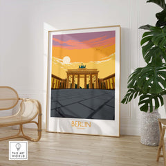 Berlin Print Germany Travel Poster featuring the iconic Brandenburg Gate in sunset colors, framed and styled in a modern interior.