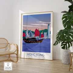 Hong Kong print showcasing a vintage-style travel poster with a traditional boat and skyline in a minimalist room.