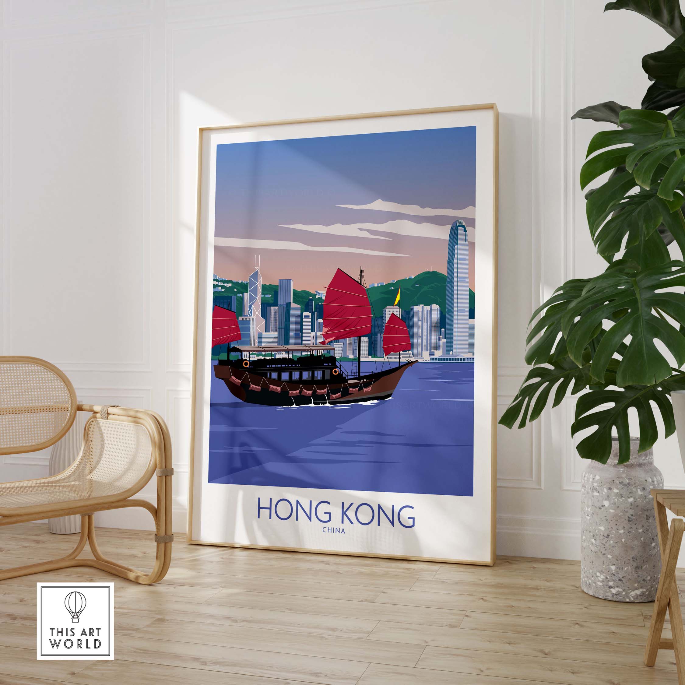 Hong Kong print showcasing a vintage-style travel poster with a traditional boat and skyline in a minimalist room.