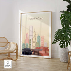 Hong Kong skyline print wall art in pastel tones displayed in a modern interior setting with plants.
