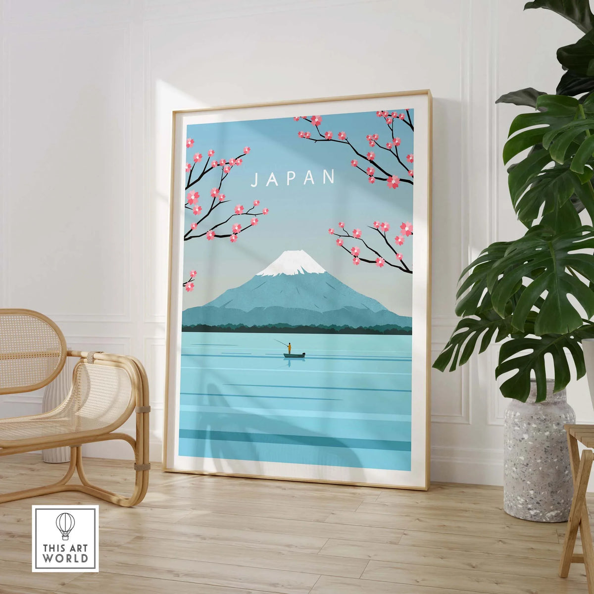 Mount Fuji wall art print featuring cherry blossoms, framed in a stylish interior design setting.