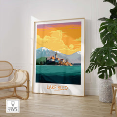Lake Bled poster featuring a sunset over the lake and mountains, perfect for home or office decor.