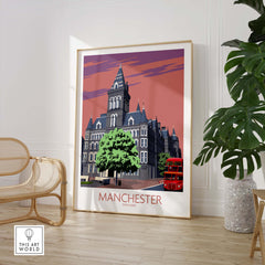 Manchester art print featuring vintage style architecture and a red double-decker bus, showcased in a stylish interior setting.