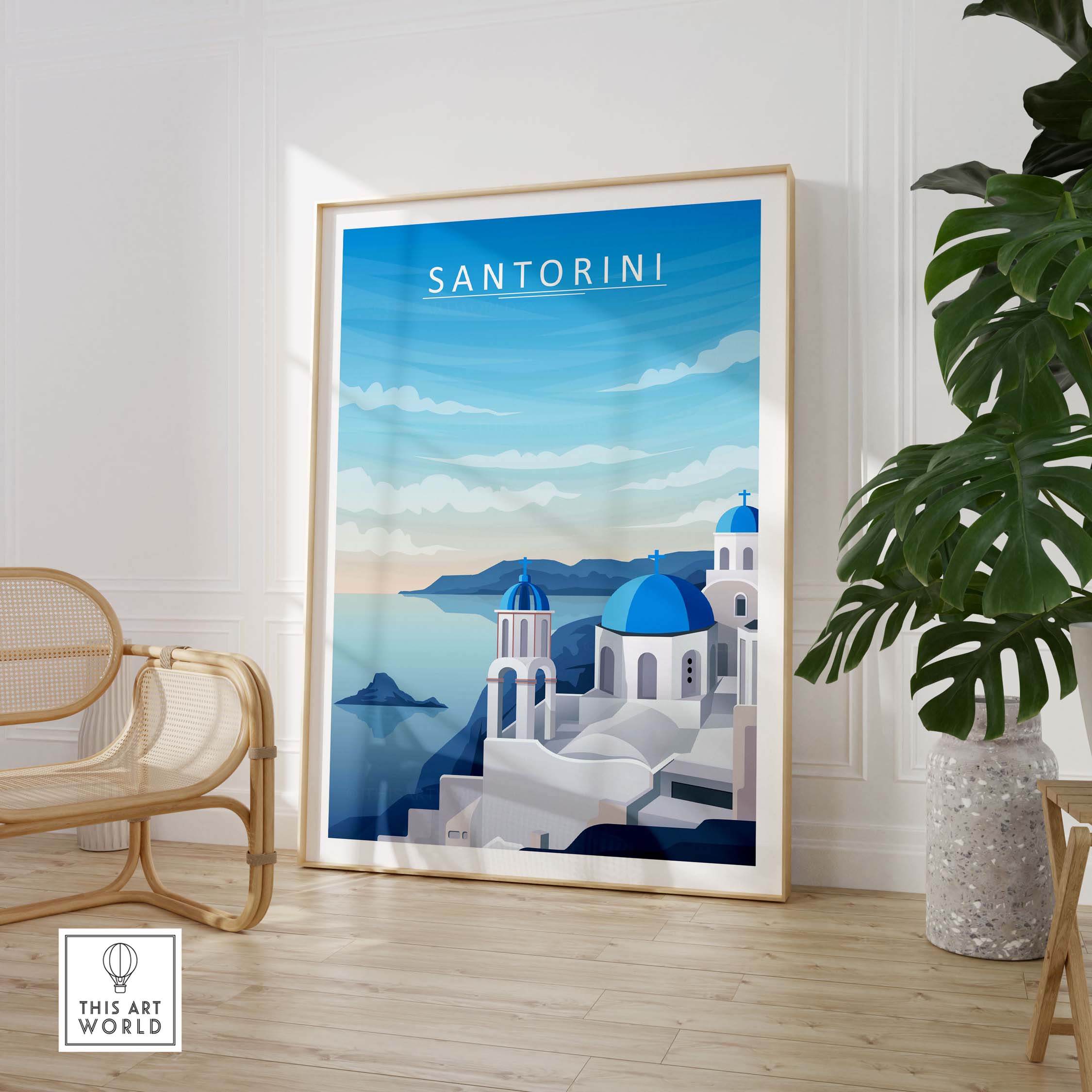 Santorini print wall art showcasing minimalist design and blue domes in a stylish interior setting.