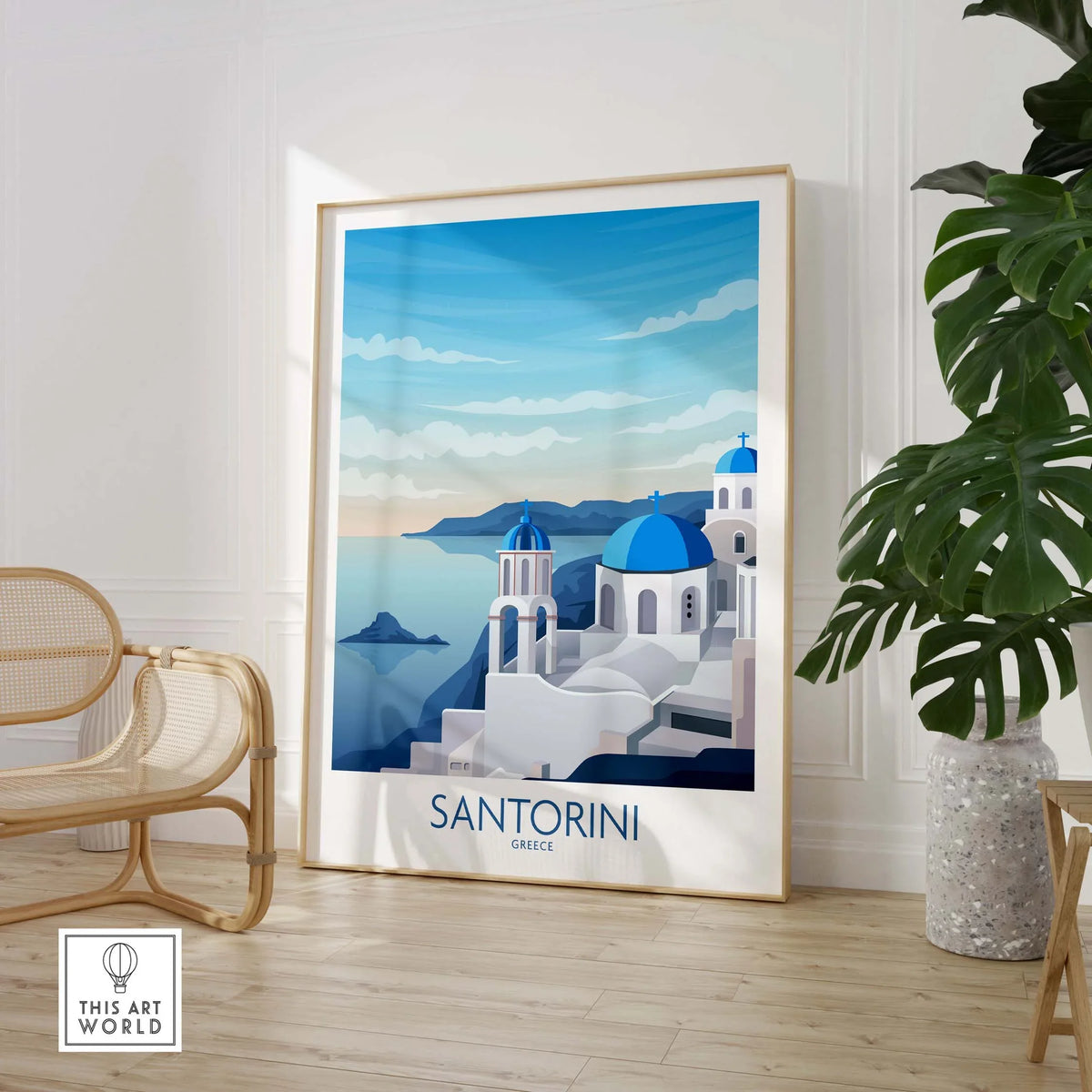 Framed Santorini wall art featuring a picturesque blue and white coastal scene of Greece.