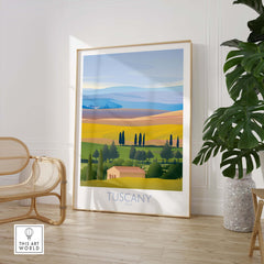 Tuscany wall art print showcasing vibrant landscapes and vintage travel poster design in a stylish indoor setting.