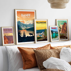 Framed Banff, Yellowstone, and Joshua Tree National Park posters displayed in a stylish home setting.