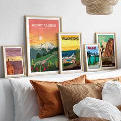 Framed Mount Rainier and National Park prints displayed on a stylish wall with decorative pillows.