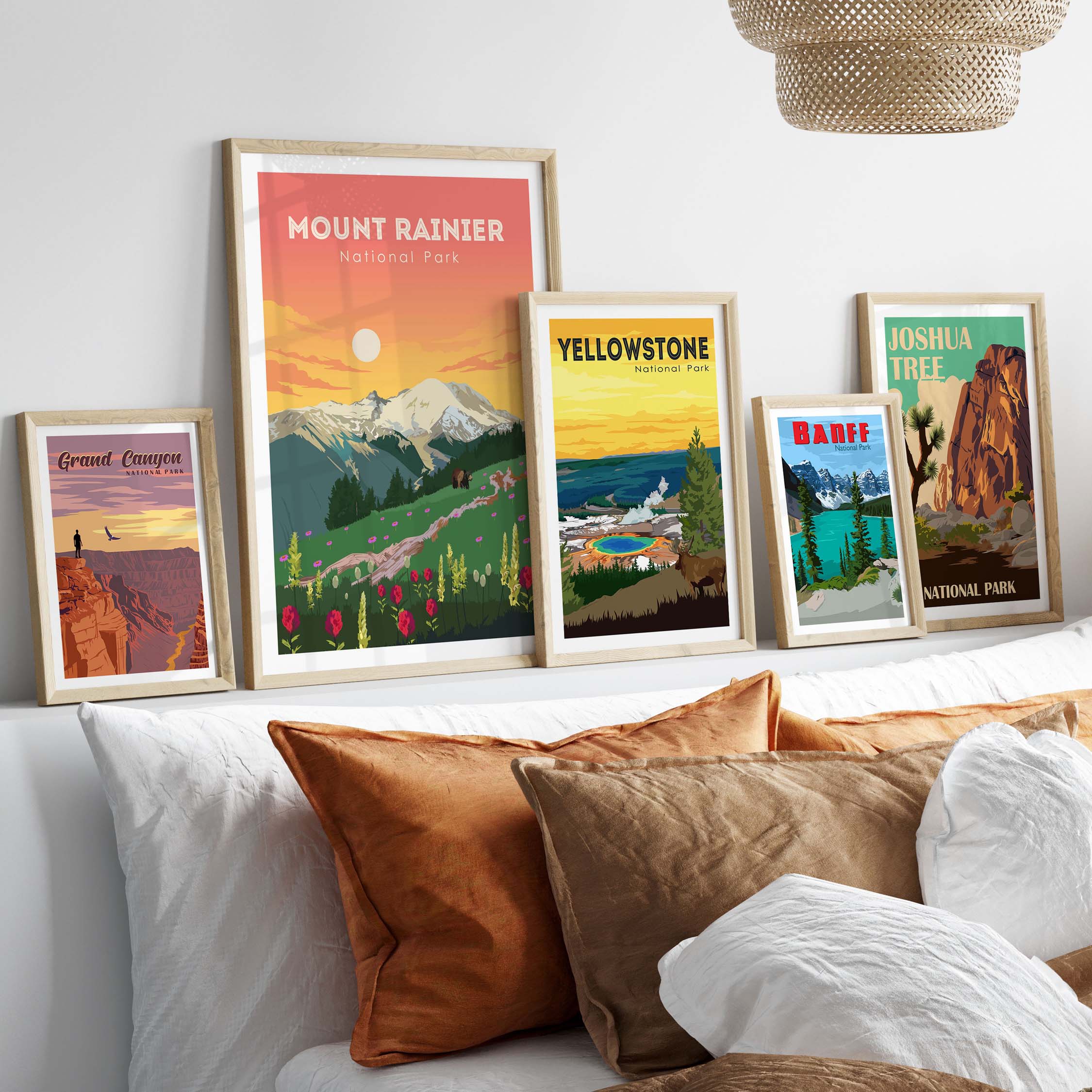 Framed Mount Rainier and National Park prints displayed on a stylish wall with decorative pillows.